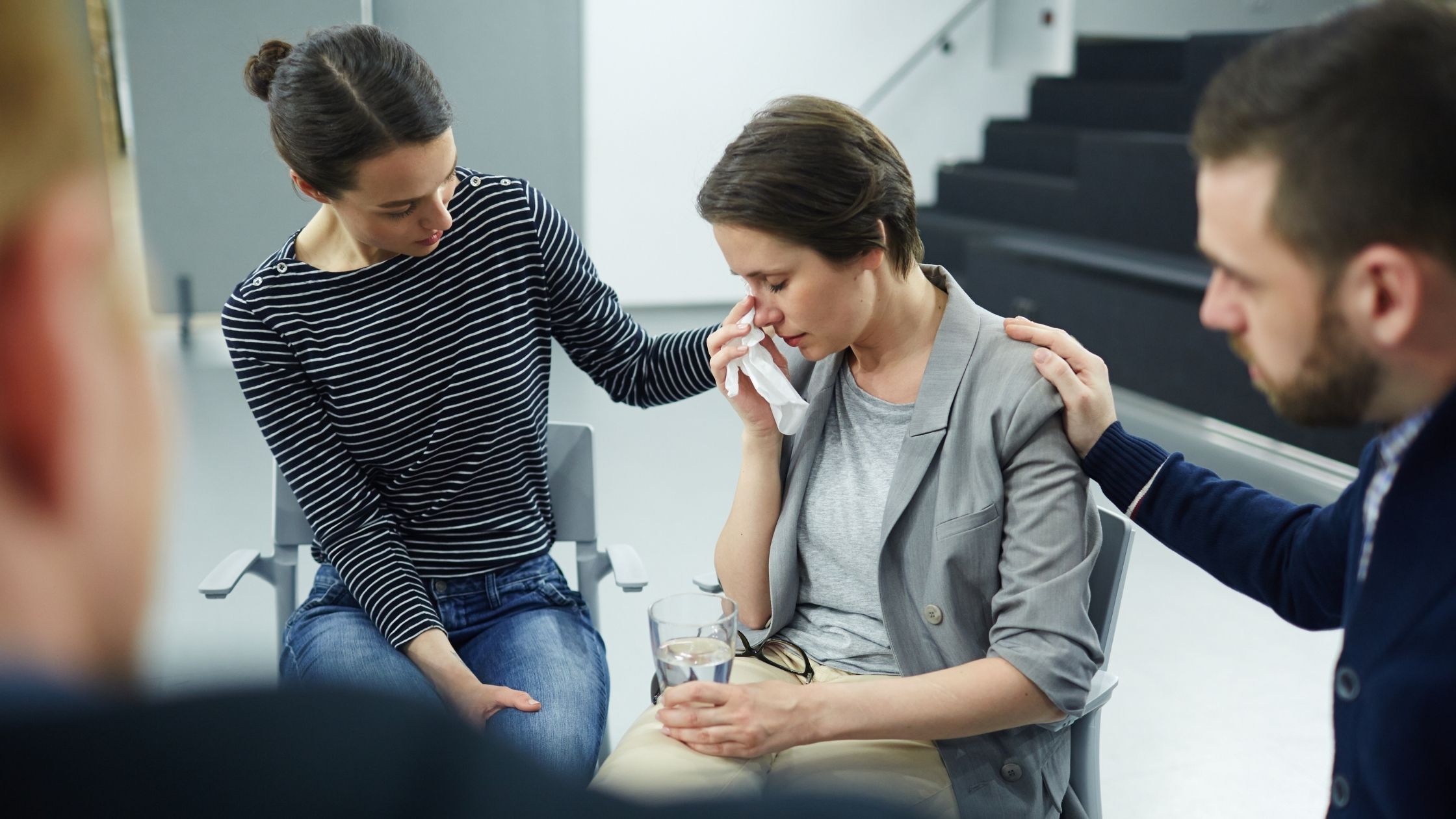 friends offering an emotional support to their friend