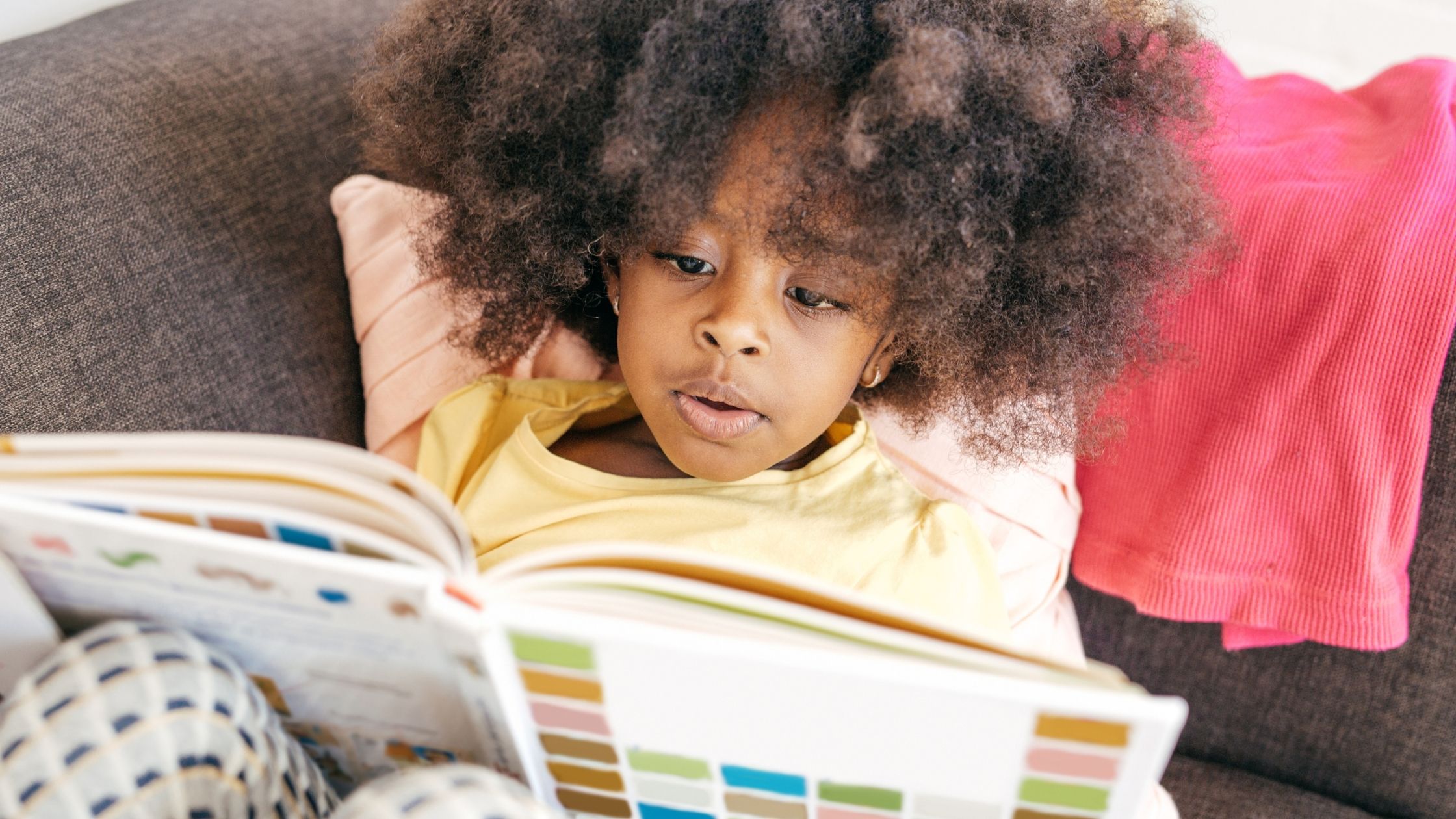 A kid reading a book