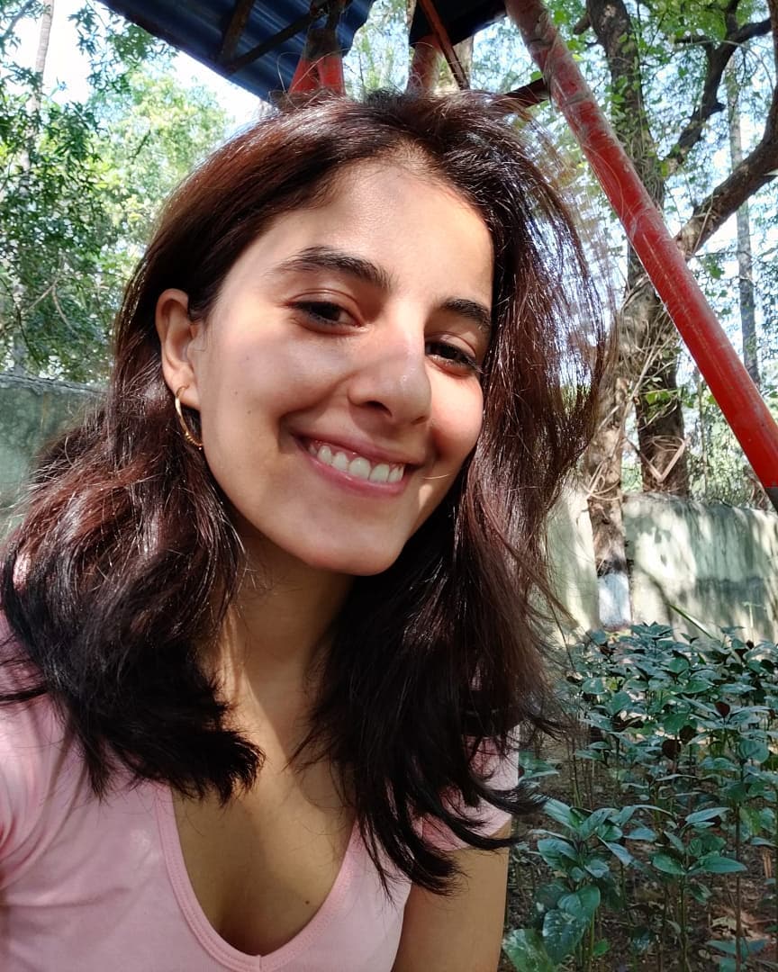 Isha Talwar taking selfie in a green environment 