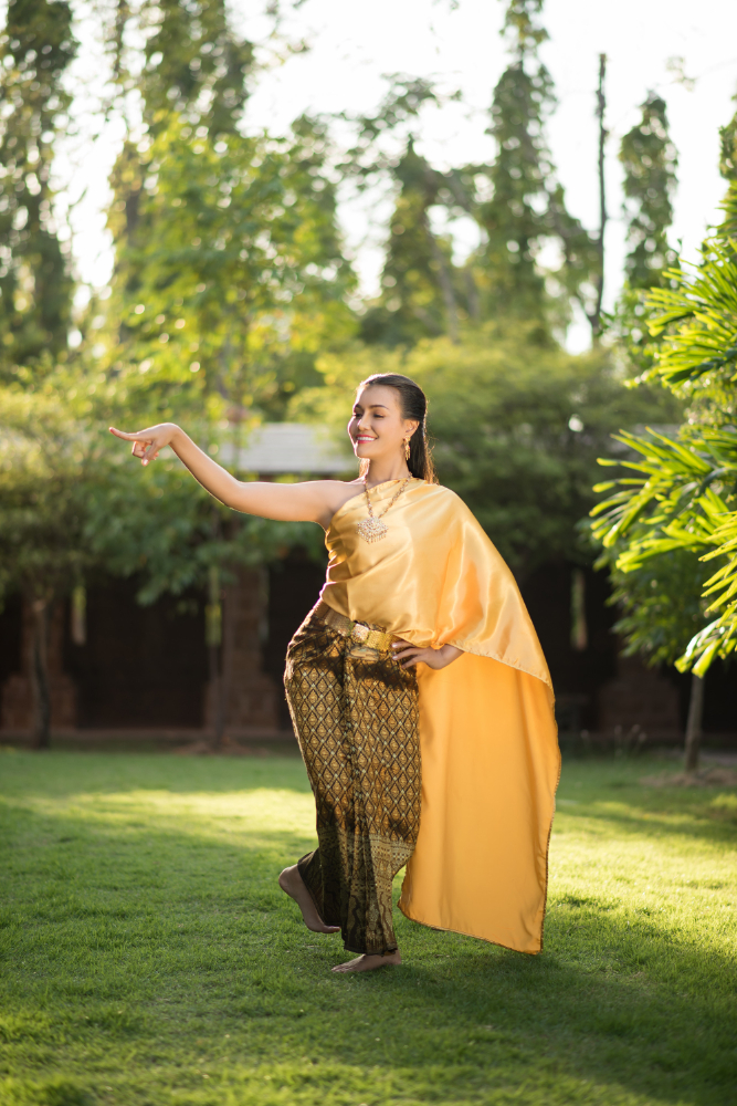 Beautiful woman in sun-kissed saree pose