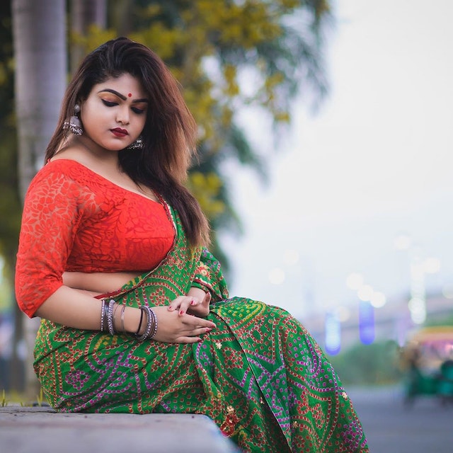 Women in saree looking down 