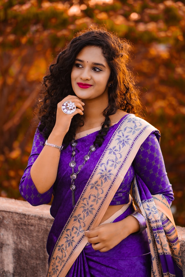 Woman in saree with a look away pose