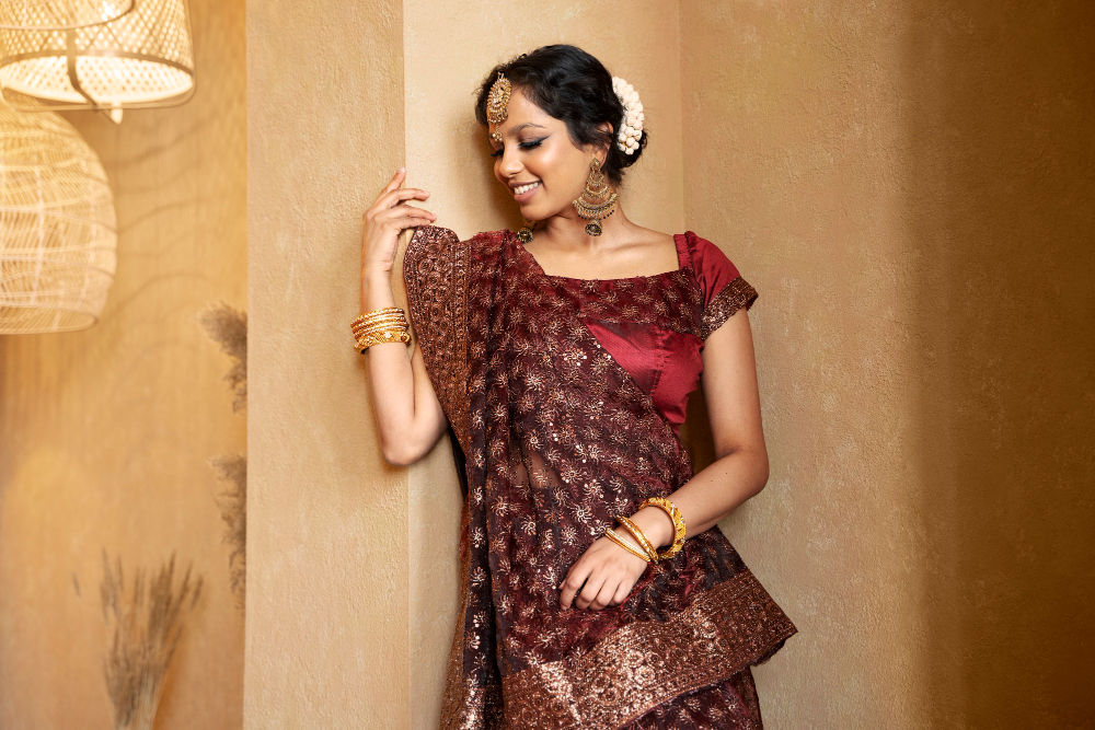 Young Woman in saree Leaning Against the wall