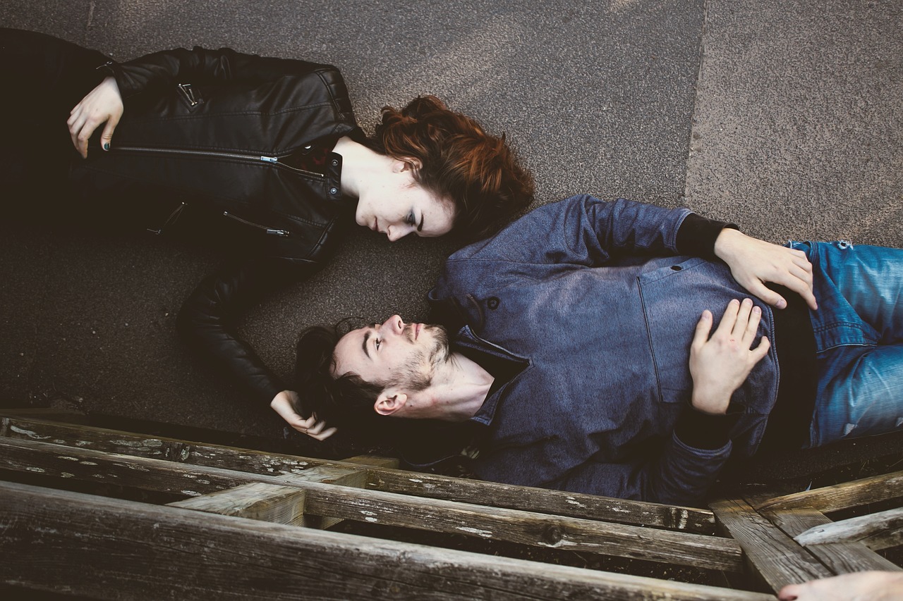 Romantic Couple Lying on Floor and Maintaining Eye Contact