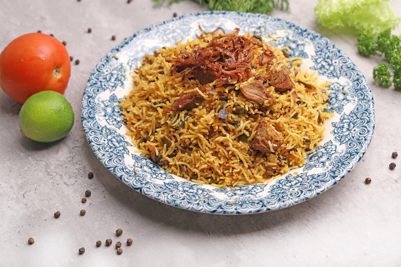 Rice Biryani Dish on Blue Plate 